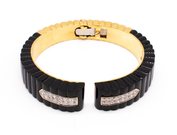 EUROPEAN MODERNIST 18 KT BRACELET WITH CARVED ONYX AND 2.10 Cts OF DIAMONDS