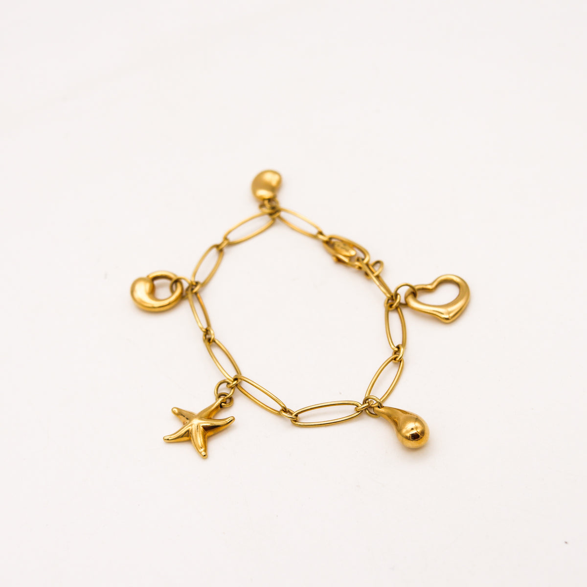 Charitybuzz: Elsa Peretti Tiffany & Co. 18k Gold Five Stone Charm Bracelet