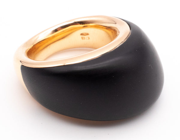 CARL BUCHERER SWISS 18 KT ROSE GOLD MODERNIST RING WITH CARVED EBONY