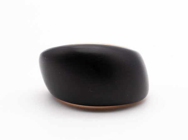 CARL BUCHERER SWISS 18 KT ROSE GOLD MODERNIST RING WITH CARVED EBONY