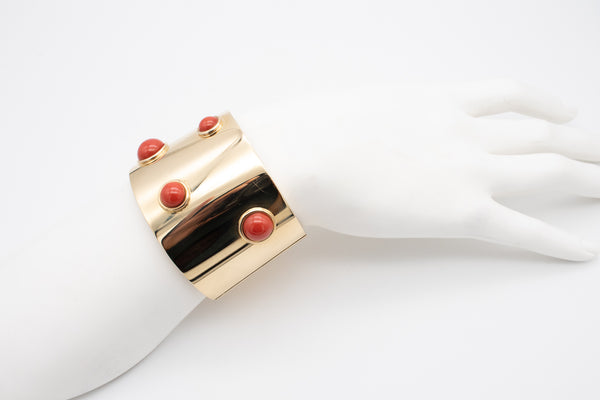 FRED JOAILLIER, PARIS 18 KT GOLD MASSIVE MODERN ARM CUFF WITH FOUR RED CORAL