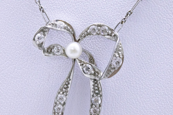 PLATINUM 1910 EDWARDIAN LARIAT WITH DIAMONDS AND NATURAL PEARLS