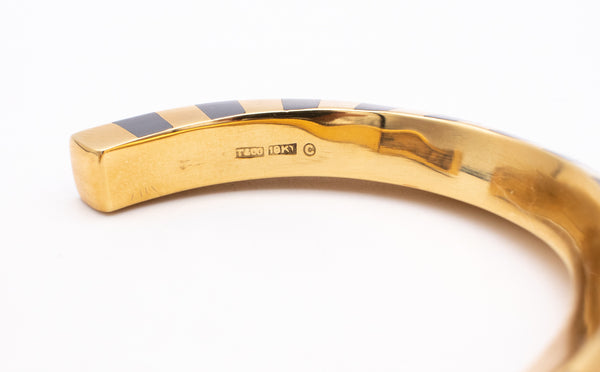 ANGELA CUMMINGS 1970'S FOR TIFFANY & CO. 18 KT GEOMETRIC BANGLE WITH HEMATITE