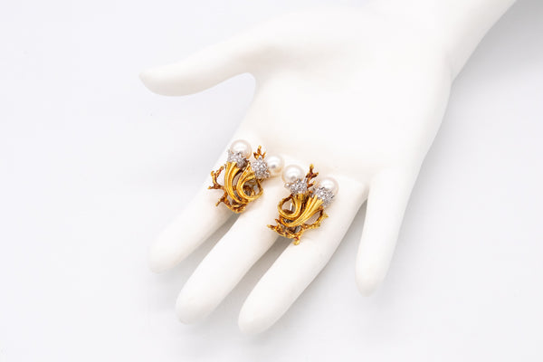 *Torchiere earrings in 18 kt gold and platinum with vs diamonds & white pearls