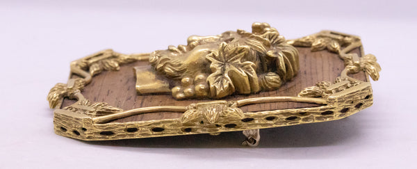 ALDO CIPULLO 1960 PENDANT BROOCH OF BACCHUS IN 18 KT AND WOOD