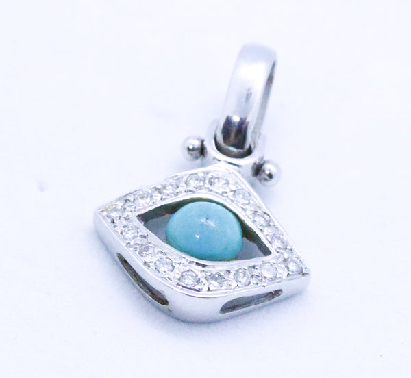 EYE OF HORUS CHARM 18 KT WITH DIAMONDS AND TURQUOISE
