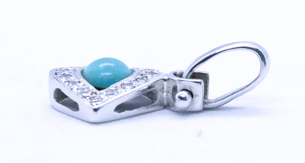 EYE OF HORUS CHARM 18 KT WITH DIAMONDS AND TURQUOISE