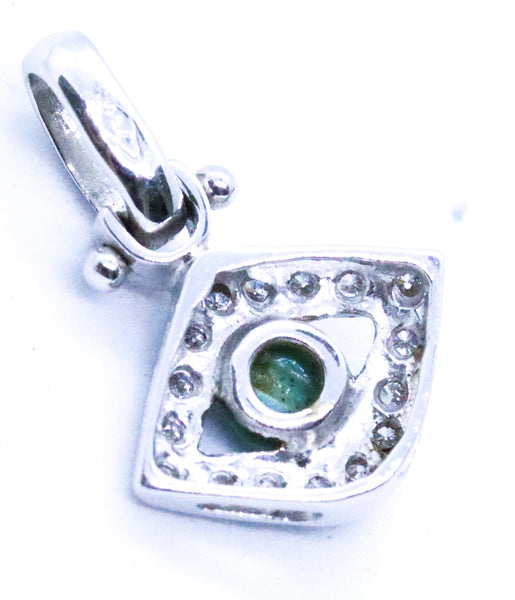 EYE OF HORUS CHARM 18 KT WITH DIAMONDS AND TURQUOISE