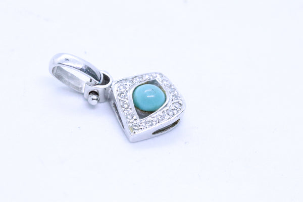 EYE OF HORUS CHARM 18 KT WITH DIAMONDS AND TURQUOISE