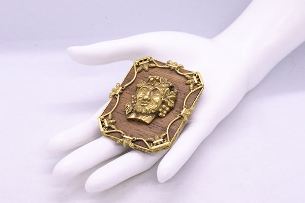 ALDO CIPULLO 1960 PENDANT BROOCH OF BACCHUS IN 18 KT AND WOOD