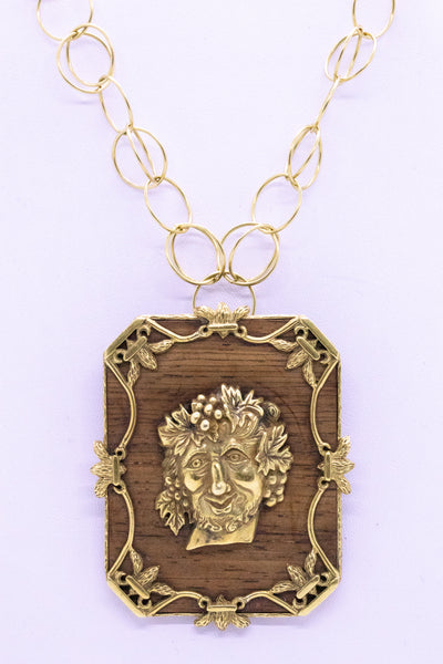 ALDO CIPULLO 1960 PENDANT BROOCH OF BACCHUS IN 18 KT AND WOOD