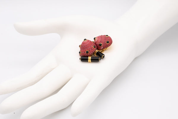 SEAMAN SCHEPPS, TRIANON 18 KT GOLD SHELL CUFFLINKS WITH GEMSTONES