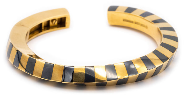 ANGELA CUMMINGS 1970'S FOR TIFFANY & CO. 18 KT GEOMETRIC BANGLE WITH HEMATITE