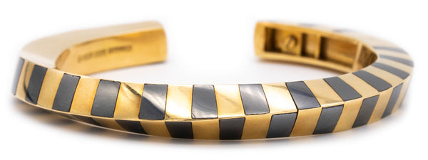 ANGELA CUMMINGS 1970'S FOR TIFFANY & CO. 18 KT GEOMETRIC BANGLE WITH HEMATITE