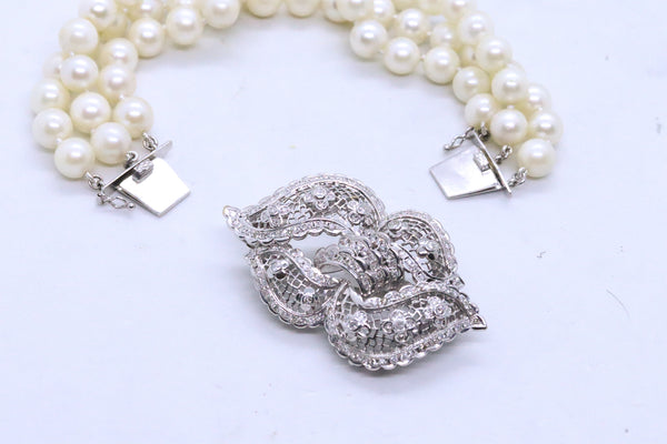 PEARLS BRACELET IN 14 KT WITH DIAMONDS CONVERTIBLE INTO BROOCH