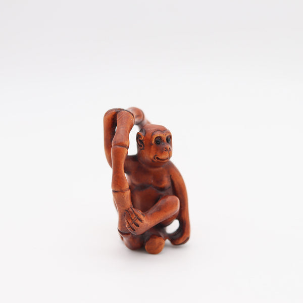 JAPAN 1880 Meiji Period Carved Wood Netsuke Of A Seated Monkey With Onyx Eyes