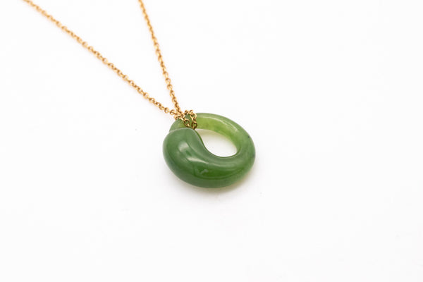 *Tiffany & Co. 1980 Elsa Peretti Eternal circle necklace in 18 kt yellow gold with nephrite jade