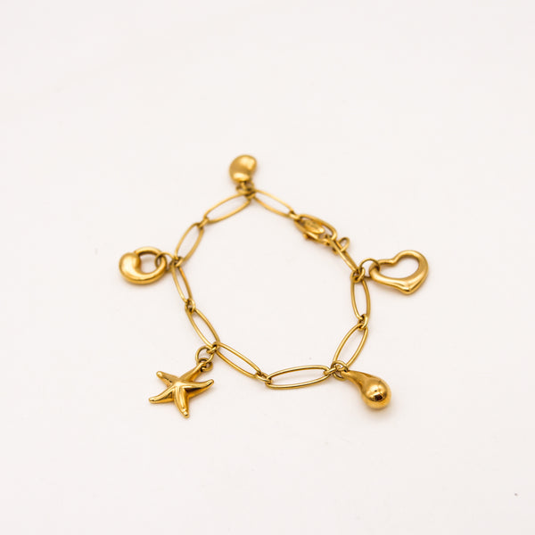 *Tiffany & Co. 1980 Elsa Peretti Five Charms Bracelet in solid 18 kt Yellow Gold