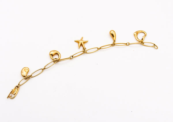 *Tiffany & Co. 1980 Elsa Peretti Five Charms Bracelet in solid 18 kt Yellow Gold