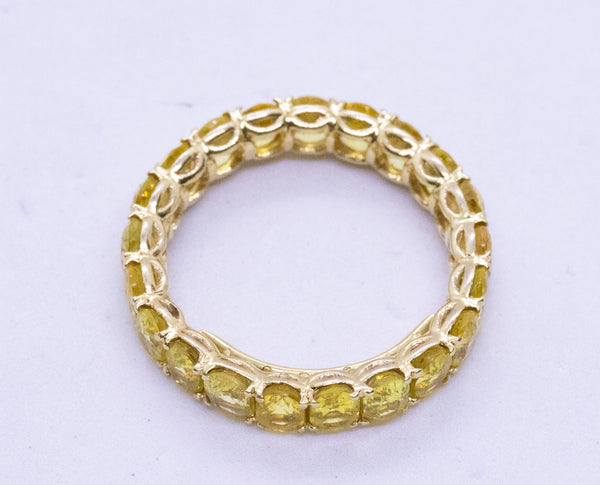 YELLOW SAPPHIRE ETERNITY 18 KT RING