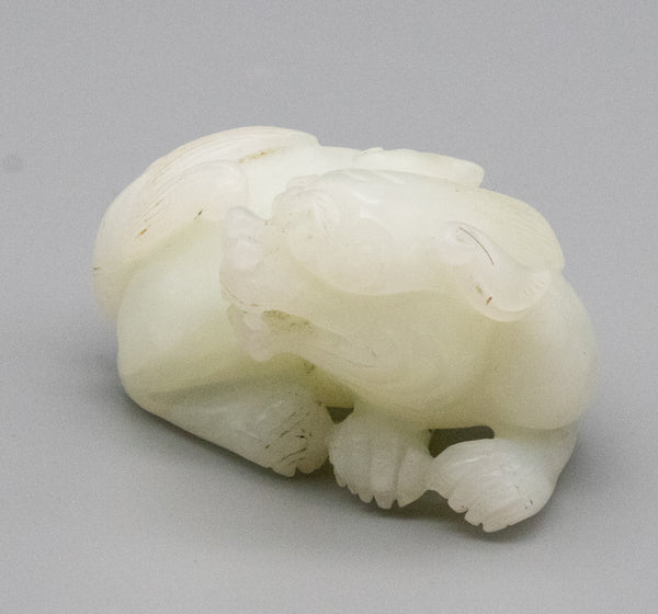 +China Qing Dynasty 18th Century Reclining Foo Dog Carved In White Nephrite Jade Gia Certified