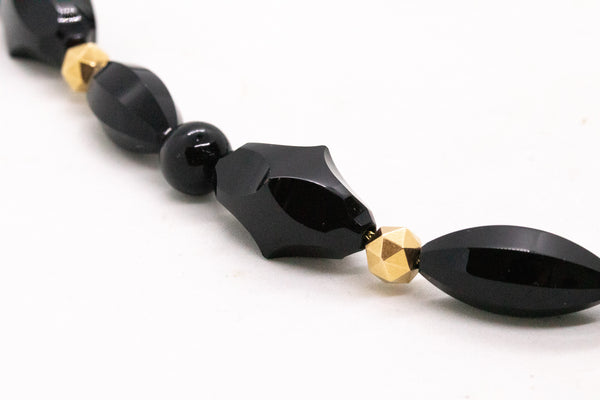 VICTORIAN 18 KT NECKLACE WITH MULTIPLES CARVINGS OF BLACK ONYX