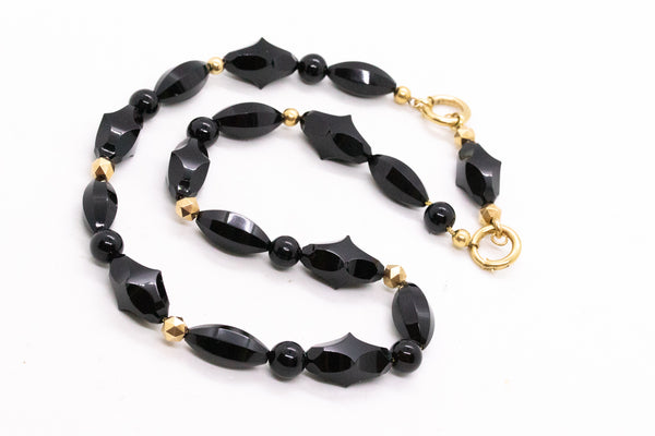 VICTORIAN 18 KT NECKLACE WITH MULTIPLES CARVINGS OF BLACK ONYX