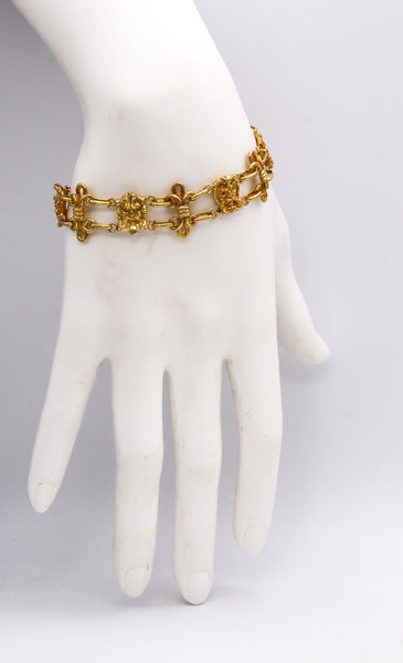 GERMANO, NINO D'ANTONIO 18 KT GOLD CHAINED BRACELET WITH THEATER FACES MEDALLION