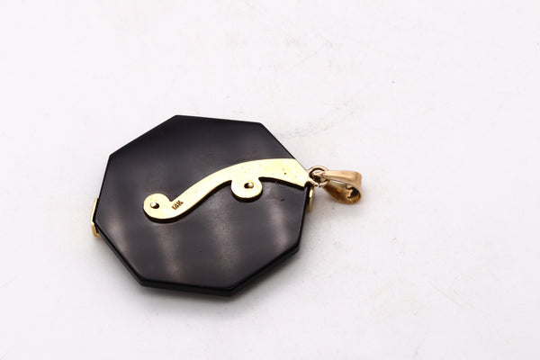 *Modernism 1970’s octagonal pendant in 18 kt yellow gold with VS diamonds coral & onyx