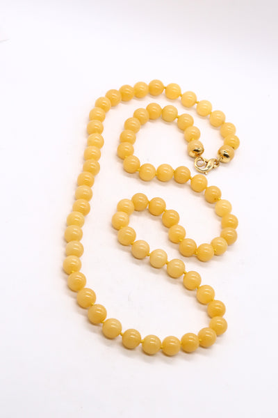 GIA CERTIFIED YELLOW JADE LONG SAUTOIRE MOUNTED IN 18 KT YELLOW GOLD