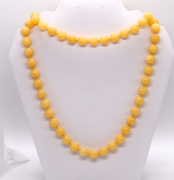 GIA CERTIFIED YELLOW JADE LONG SAUTOIRE MOUNTED IN 18 KT YELLOW GOLD