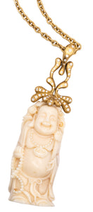 *Donald Huber 18 kt yellow necklace with standing Buddha in coral and 1.06 cts diamonds