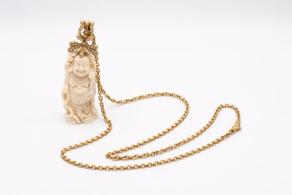 *Donald Huber 18 kt yellow necklace with standing Buddha in coral and 1.06 cts diamonds