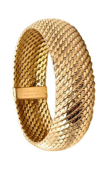 *Tiffany & Co. France 1960 by L’Enfant rare 18 kt gold mesh bracelet bangle