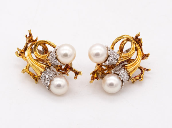*Torchiere earrings in 18 kt gold and platinum with vs diamonds & white pearls