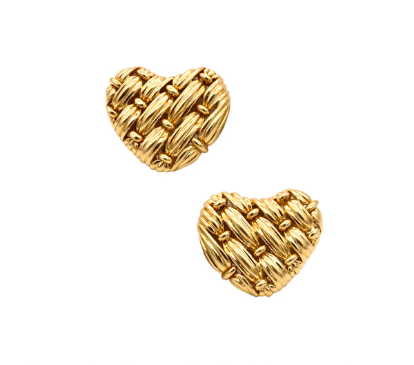 *Tiffany & Co. NYC signature series woven heart earrings in 18 kt yellow gold