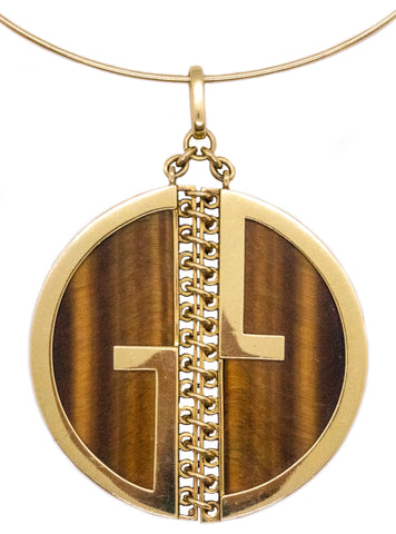 GUCCI, ITALY 18 KT GOLD GUCCIO GUCCI LOGO MASSIVE PENDANT WITH TIGER EYE