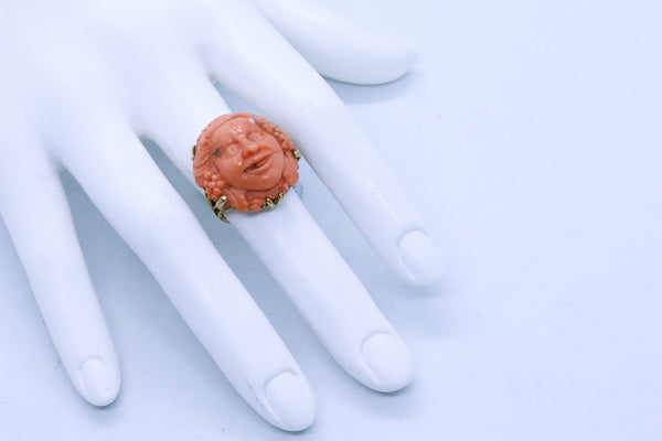 ITALIAN XIX CENTURY 18 KT RING WITH CORAL CARVING OF BACCHUS