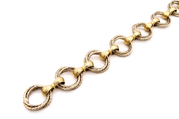 *Cartier 1967 Paris-London rare Trinity triple twisted links bracelet in two tones of 18 kt gold