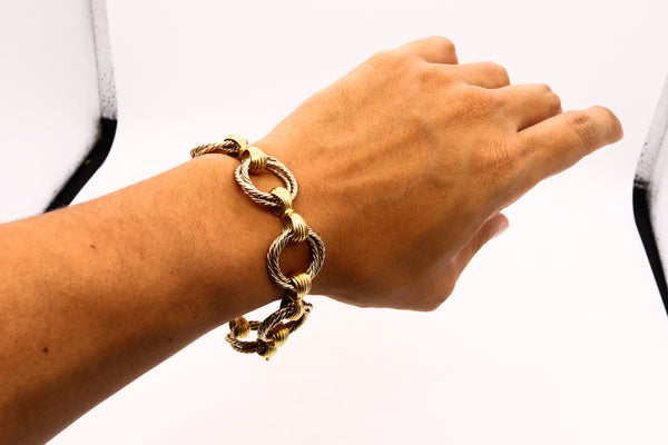 *Cartier 1967 Paris-London rare Trinity triple twisted links bracelet in two tones of 18 kt gold