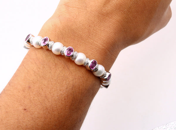 *Modern Akoya pearls cuff bracelet in 18 kt white gold with 6.15 Cts in diamonds and pink sapphires