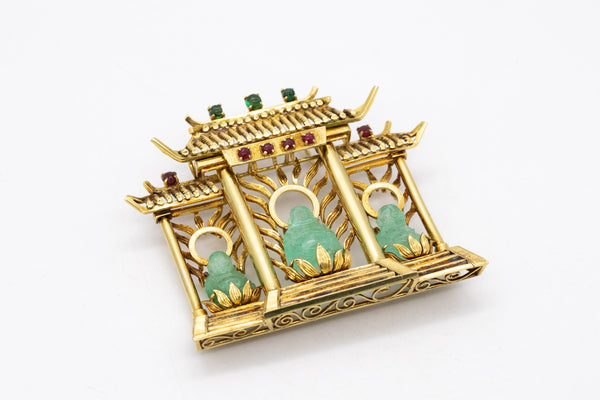 *Three-buddhas in temple Chinoiserie pendant in 18 kt yellow gold with 26.55 Ctw in emeralds & rubies
