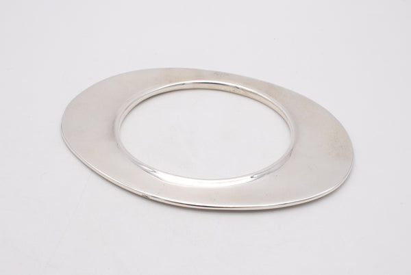 TIFFANY & CO. 1982 BY ELSA PERETTI, FLYING SAUCER OVAL BRACELET-PENDANT IN STERLING SILVER.
