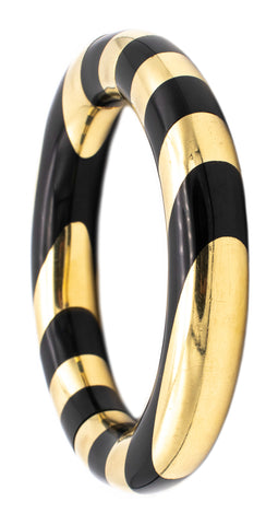 TIFFANY & CO. 1975 BY ANGELA CUMMINGS RARE 18 KT GOLD BANGLE WITH BLACK JADE STRIPES