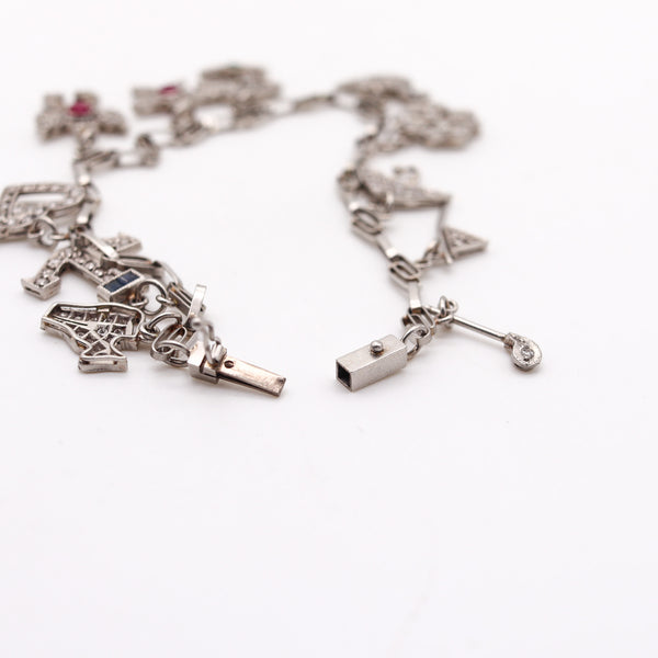 Art Deco 1930 Eleven Charms Bracelet In Platinum Enamel With 3.48 Ctw In Diamonds And Gems