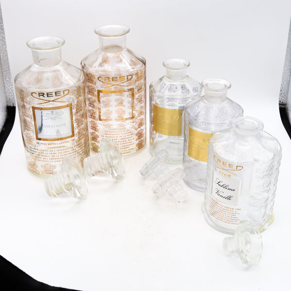 *France Creed a suite of 5 Large presentation Perfume crystal bottles for display