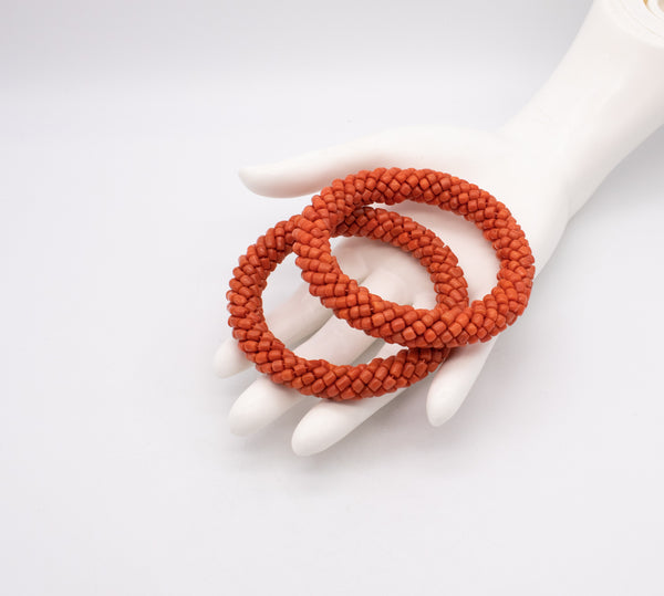 ITALIAN 1960 MODERN PAIR OF BANGLES WITH NATURAL SARDINIAN RED CORALS