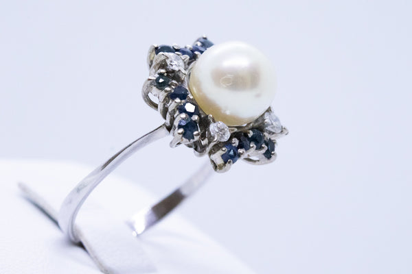 SAPPHIRE WITH DIAMONDS AND PEARL 18 KT RING