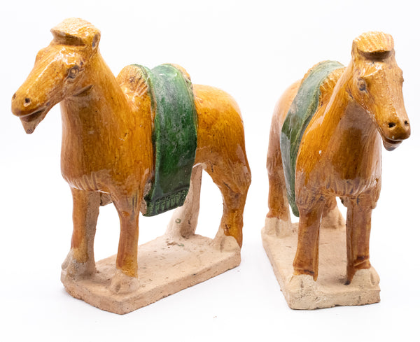 CHINA MING DYNASTY 1368-1644 AD SANCAI GLAZED EARTHENWARE PAIR OF CAMELS