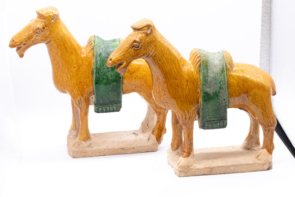 CHINA MING DYNASTY 1368-1644 AD SANCAI GLAZED EARTHENWARE PAIR OF CAMELS